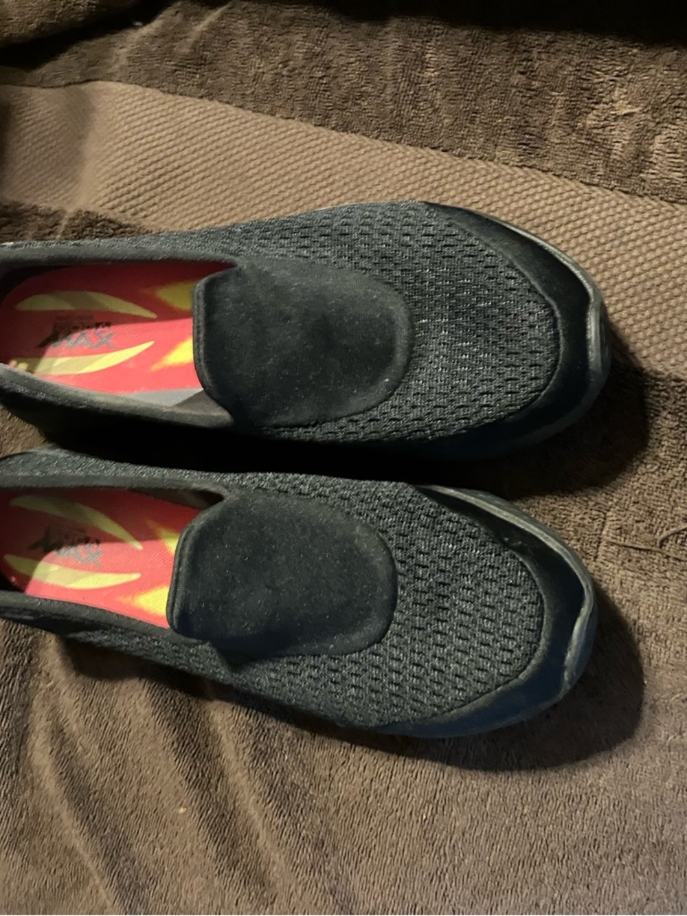Skechers Black Knit Slip-On with Red and Yellow Insole
